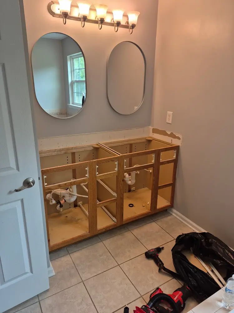 Double vanity cabinet set in place before the mirrors went up