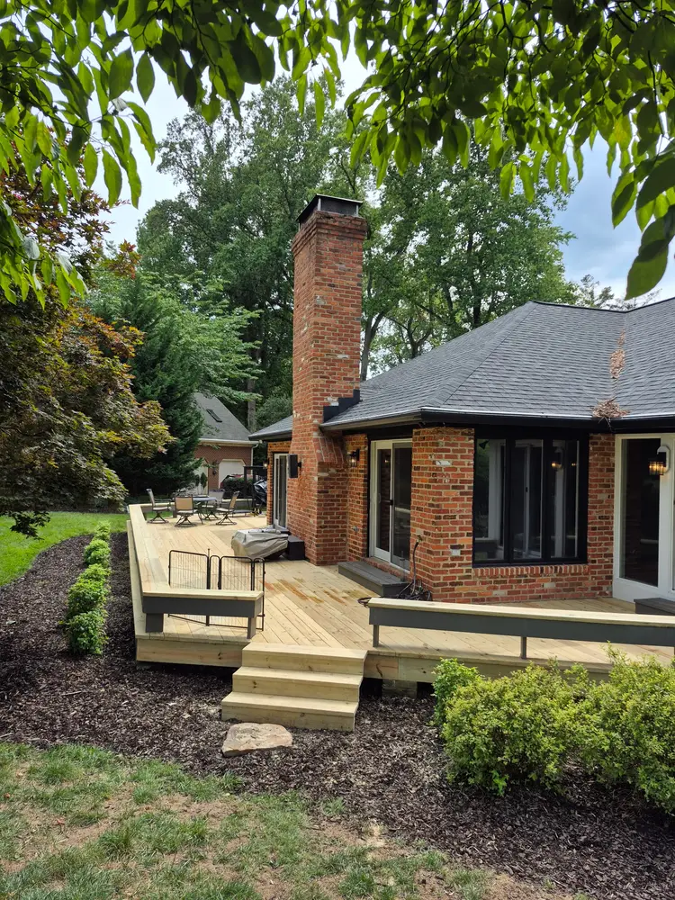 Completed pressure-treated deck with steps and skirting