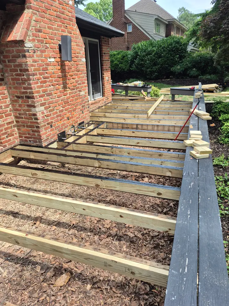 Deck frame and joists set out on new footings